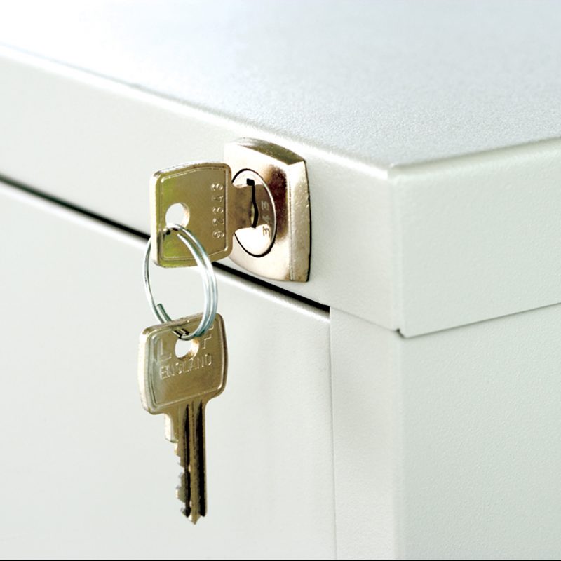Close up of lock and key on filing cabinet