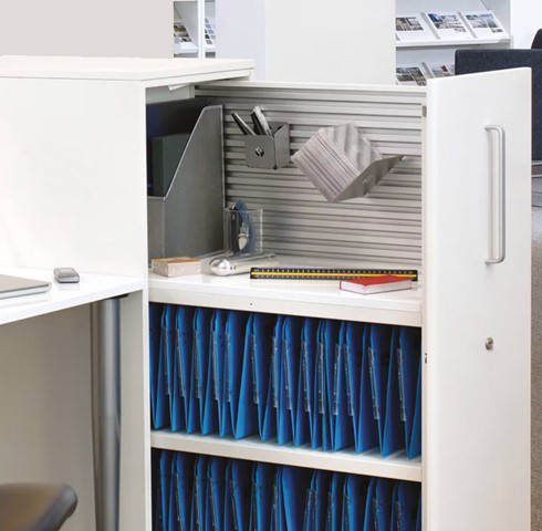 White Bisley Towers storage unit containing blue files and personal belongings