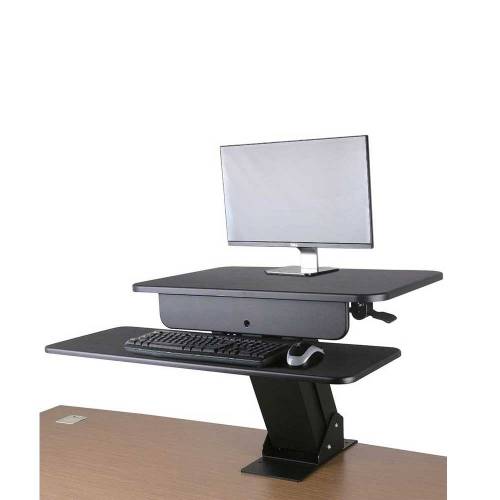 Computer screen and keyboard raised up on a desk converter