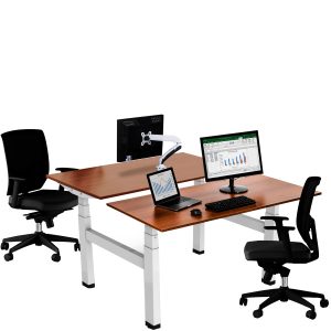 Double desk with various screens and two black chairs